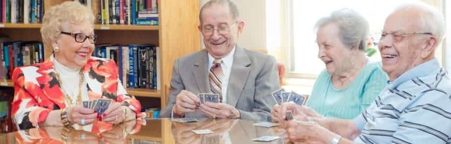 Four seniors playing cards at the Timbers of Shorewood