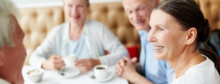 Seniors having coffee together