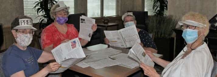 Residents of the Timbers of Shorewood with the Timbers Times