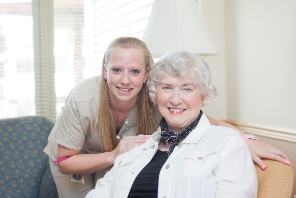 Caregiver and Senior together at the Timbers