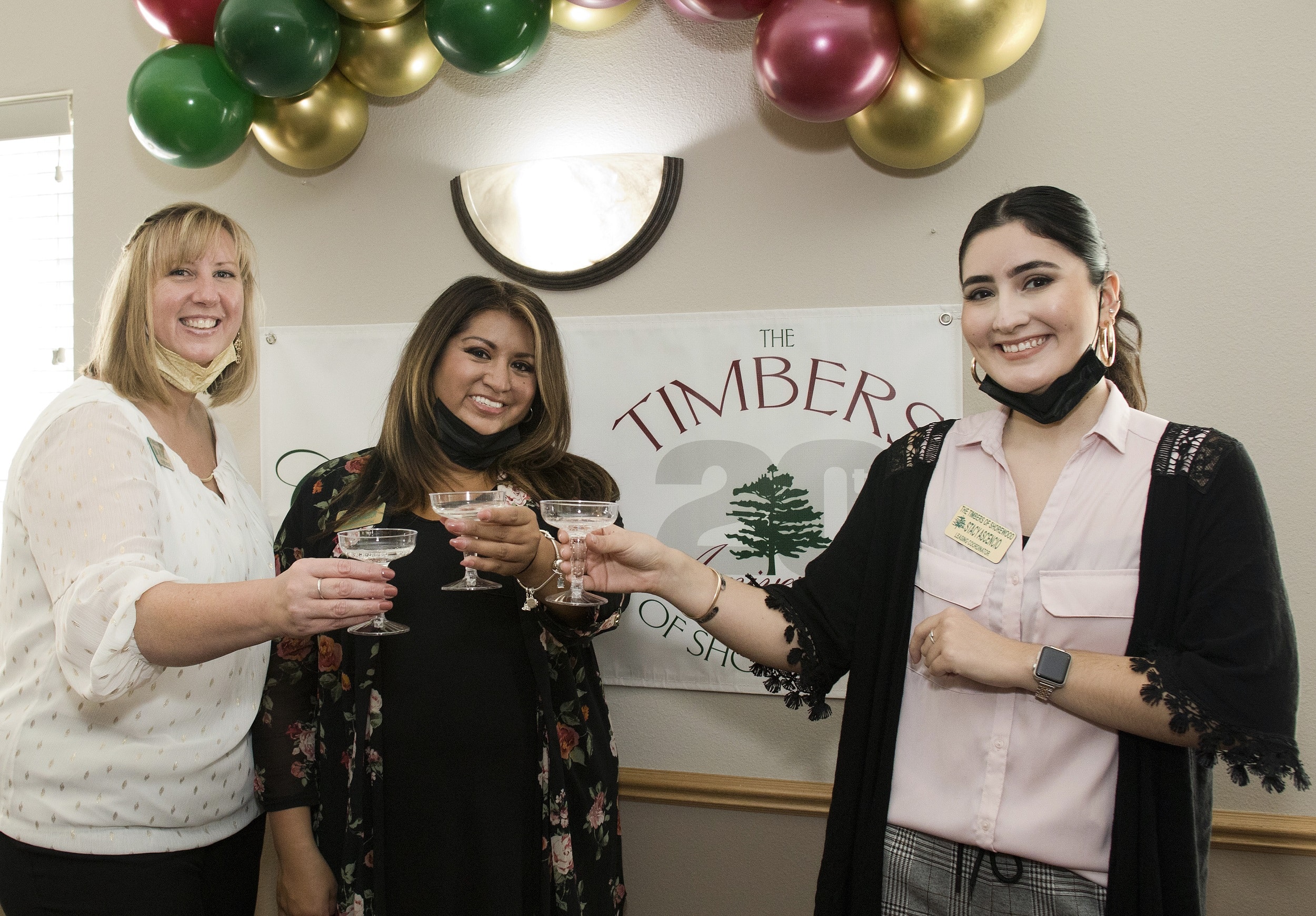 Timbers staff toasting chapmagne at the 20th Anniversary celebration
