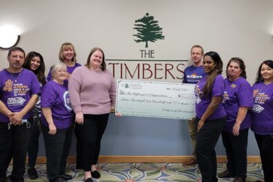 Timbers Staff holding check