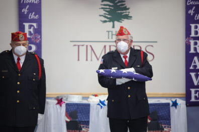 Abraham Lincoln National Cemetery Honor Guard holding a flag