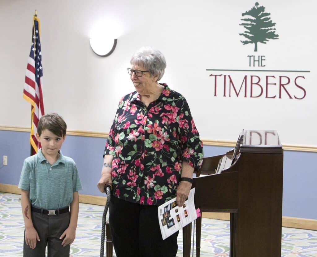 Timbers of Sorewood resident Paula Polechla and Hank Vasel, 6, perform together during a recital at Timbers of Shorewood