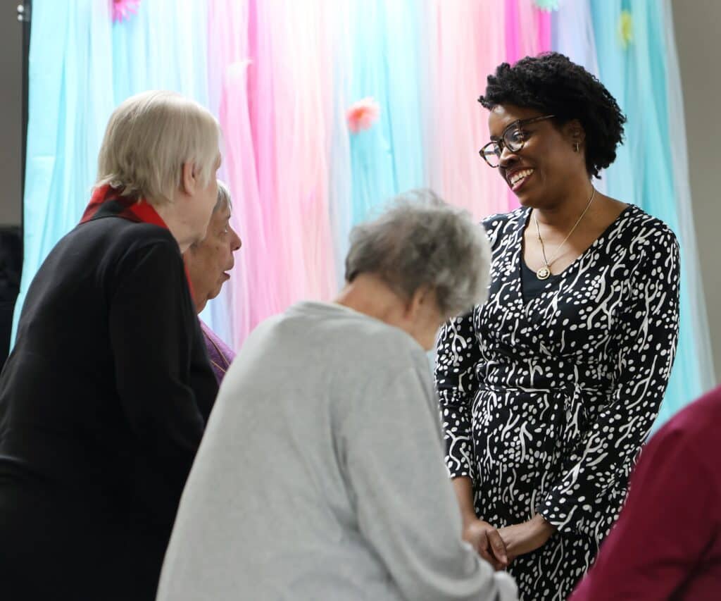Congresswoman Lauren Underwood talks to Timber of Shorewood residents Gerry Martinez, Pat Young and Mary Ann Ragusa 