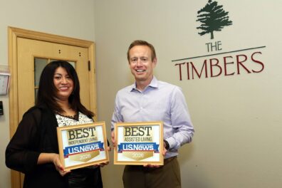 Sheila Albor, Director of Marketing and Kevin Young, Executive Director at Timbers of Shorewood with U.S. News Best Independent and Best Assisted Living Awards on Tuesday, April 14, 2026, in Shorewood, Ill.